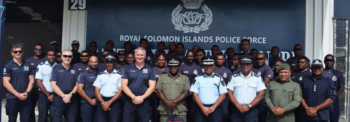 Group photos in front of the Tactical Training Centre