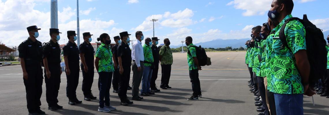 Briefing at the Henderson International airport before boarding plane for the trip to China