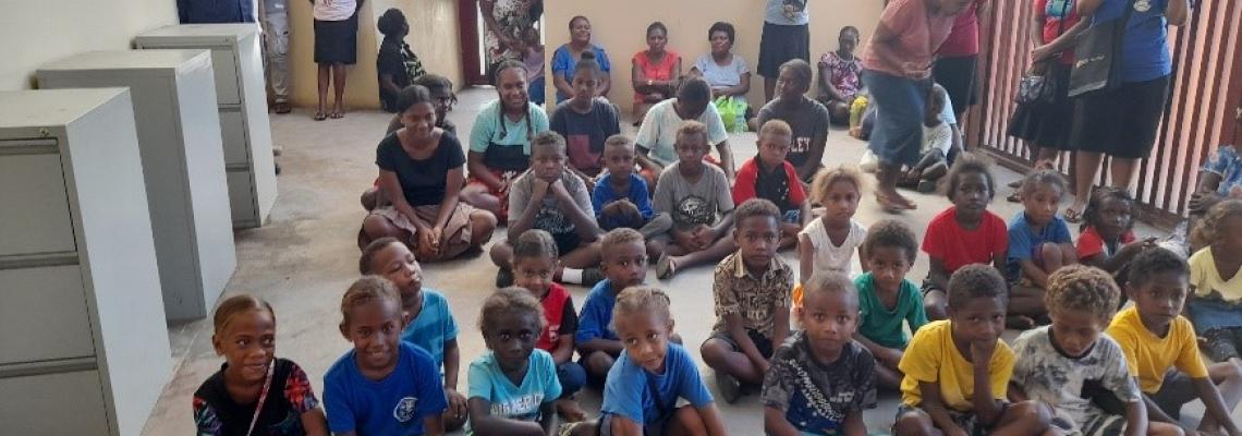 Children, teachers and parent listen to the awareness
