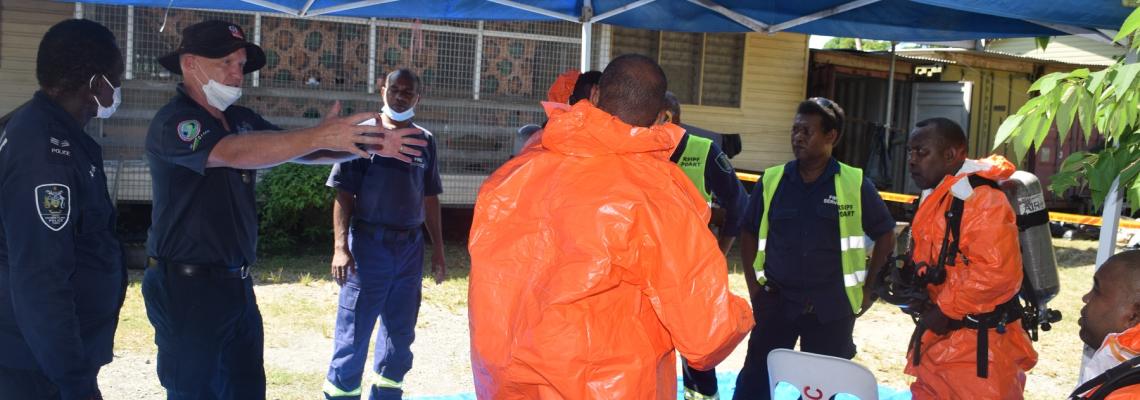 Second from( L-R) Fire Service Advisor brief the officers on how to safely remove the chemicals